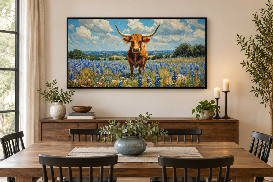 Framed canvas wall art of a Texas longhorn cow standing in a field of bluebonnets.