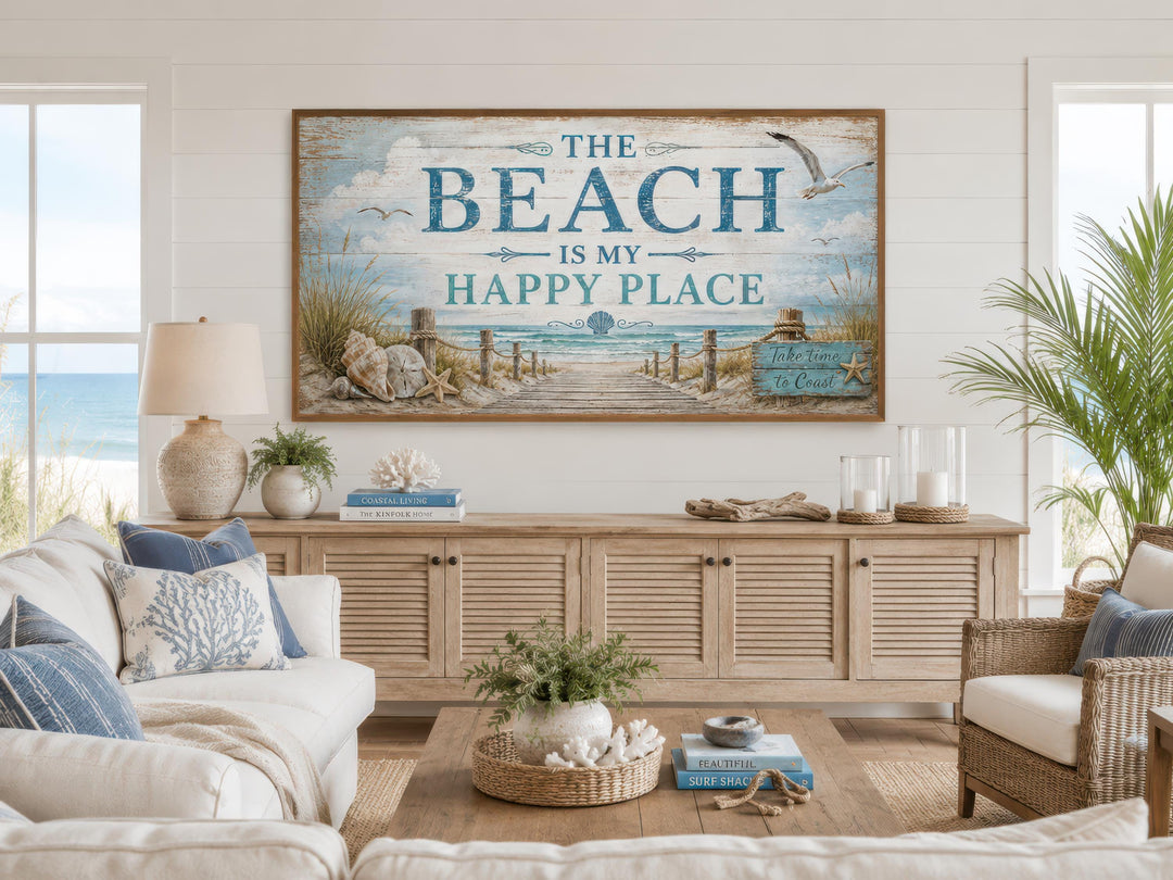 Coastal living room with a large wooden sign reading 'The Beach Is My Happy Place' above a sideboard.