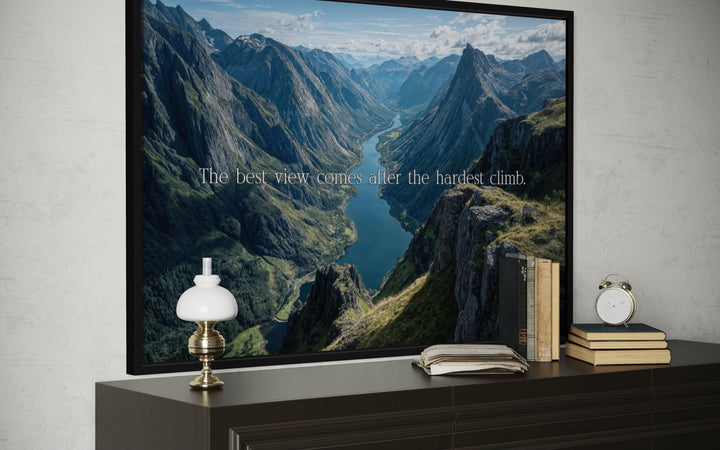 Wall art with a mountain landscape and the quote "The best view comes after the hardest climb."