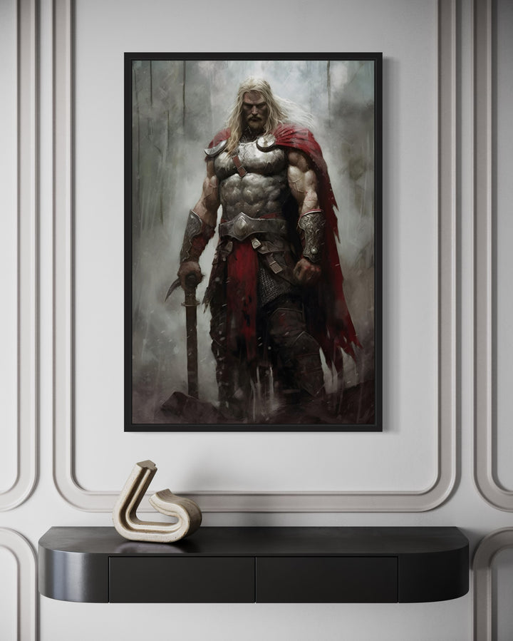 Framed canvas art of Thor in armor with a red cape, hanging above a black console table.