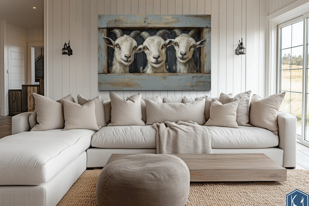 Three funny goats looking through a fake wooden window canvas wall art in a farmhouse living room.