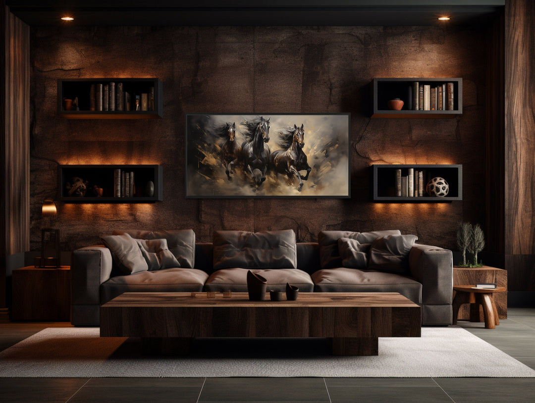 Three horses running extra large canvas wall art centered above a sofa in a rustic living room.