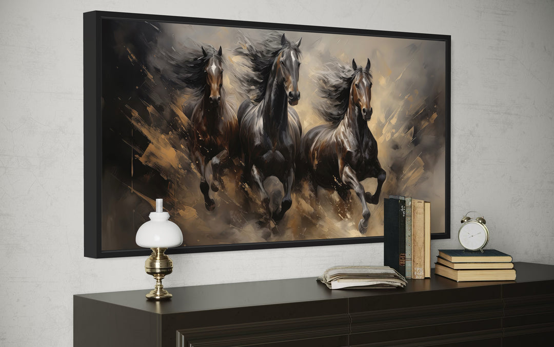 Extra large framed canvas wall art featuring three brown horses galloping with flowing manes.