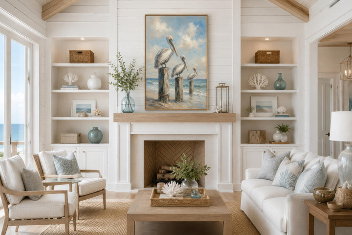 Three Pelicans on Dock Posts Coastal Canvas Wall Art hanging above a fireplace in a beach house.