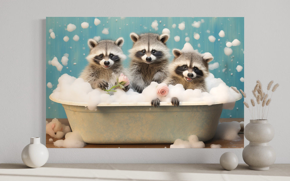 Three raccoons in a bubble-filled vintage bathtub framed canvas wall art on a neutral wall.