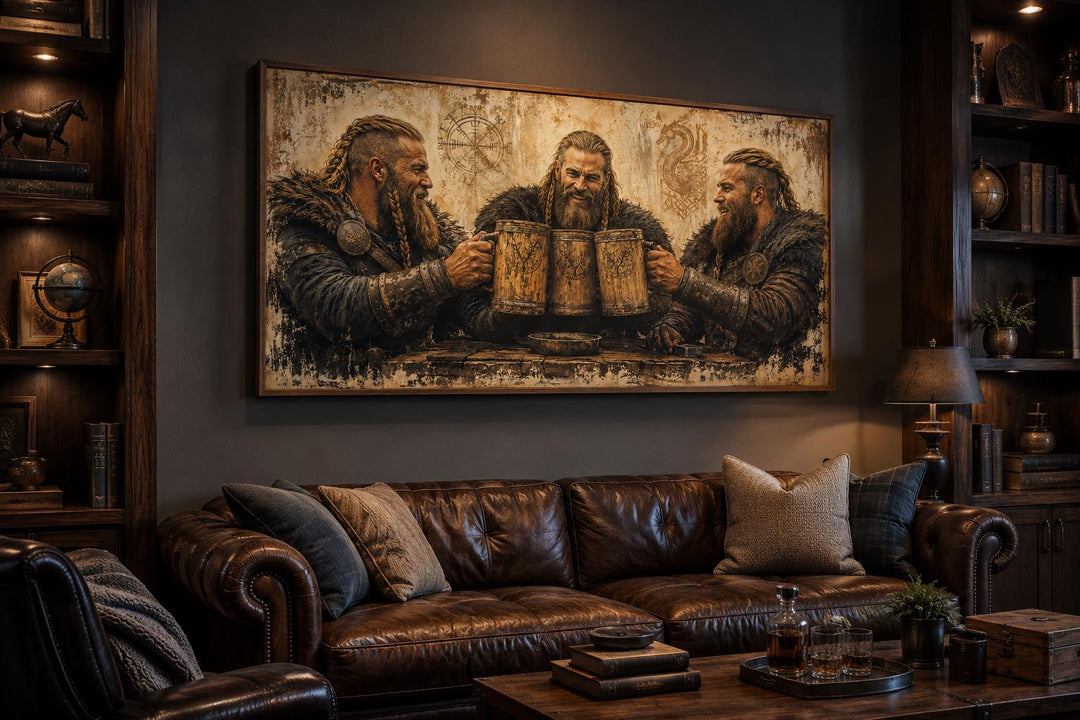 Three Vikings drinking beer canvas wall art hanging above a leather sofa in a rustic man cave.