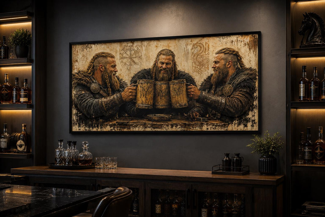Three Vikings drinking beer canvas wall art in a rustic home bar setting above a wooden cabinet.