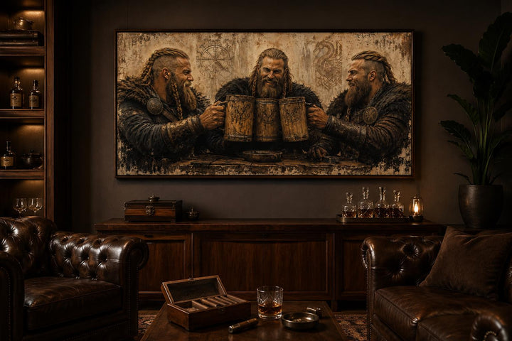 Three Vikings drinking beer canvas wall art in a rustic man cave with leather chairs and dark wood.