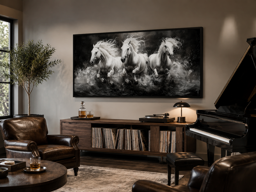 Three White Horses Running Framed Canvas Wall Art displayed above a wooden media console.