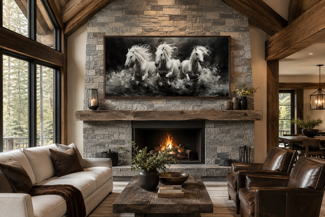 Three white horses running framed canvas wall art above a stone fireplace in a rustic living room.