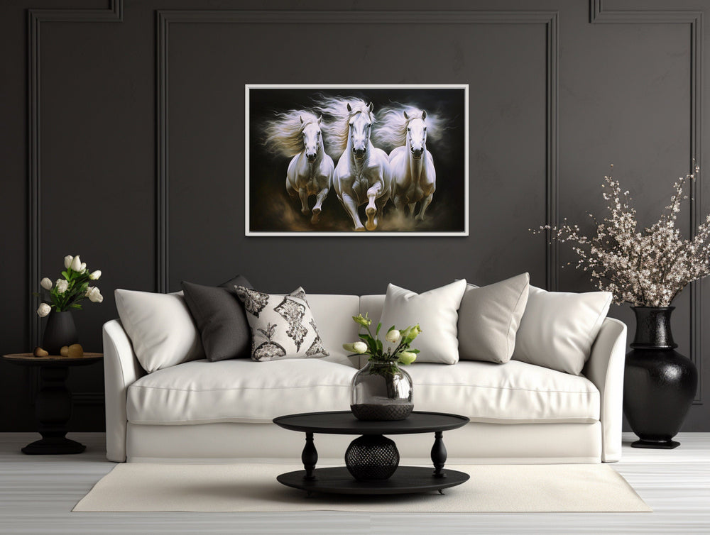 Three White Horses Running Framed Canvas Wall Art above white couch