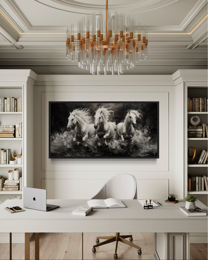 Three White Horses Running Framed Canvas Wall Art displayed above a desk in a modern office.