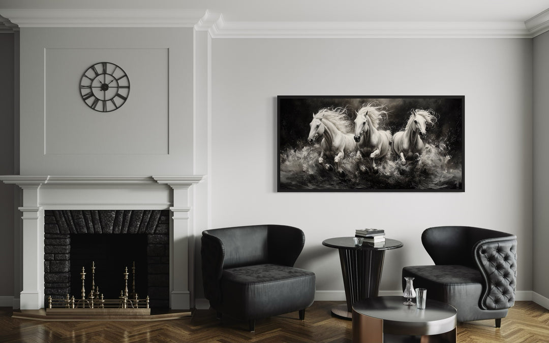 Three white horses running framed canvas wall art displayed above a modern seating area.