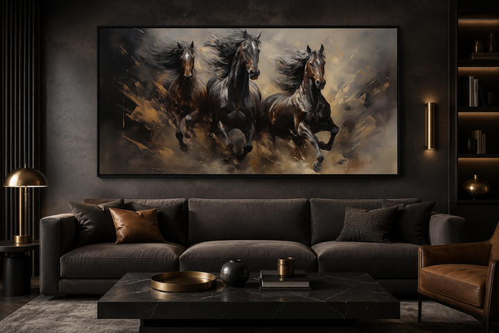Three horses running extra large canvas wall art hanging above a dark sofa in a modern living room.