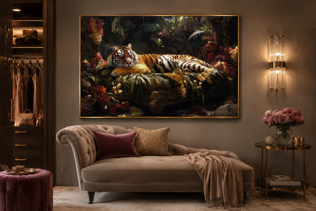 Framed canvas wall art of a tiger sleeping in a lush jungle, hanging above a beige chaise lounge.
