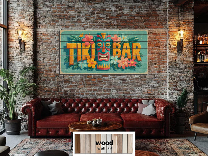 A colorful Tiki Bar sign printed on horizontal wood planks hangs on a rustic brick wall.
