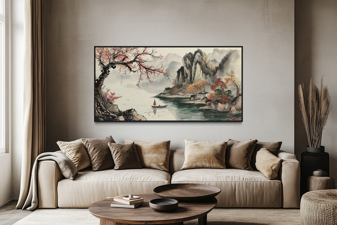 Traditional Chinese Shan Shui Hua landscape canvas wall art above a beige sofa in a living room.