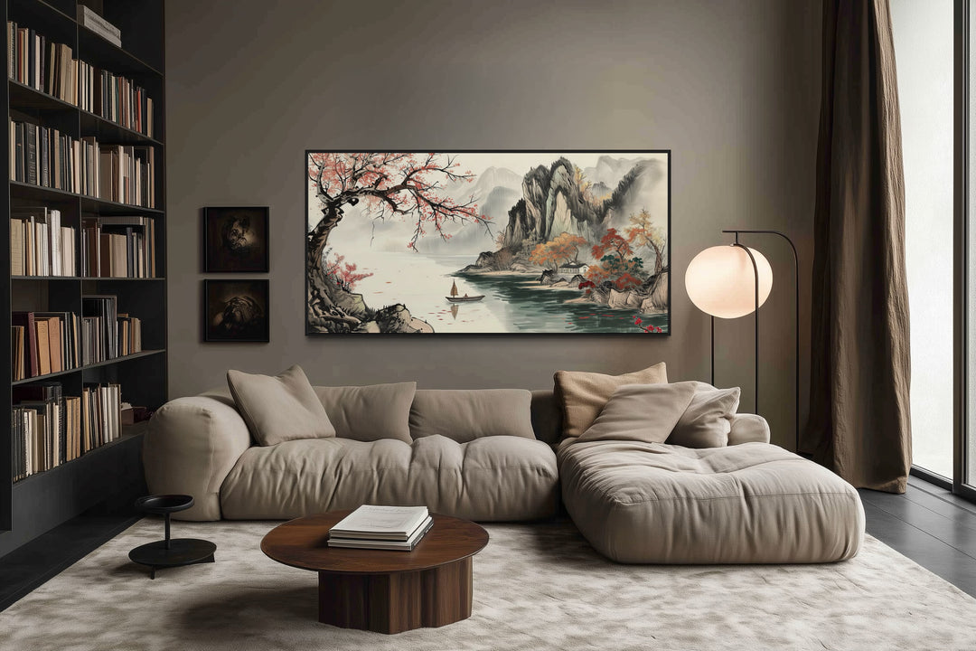 Traditional Chinese Shan Shui Hua landscape canvas wall art above a modern sofa in a living room.