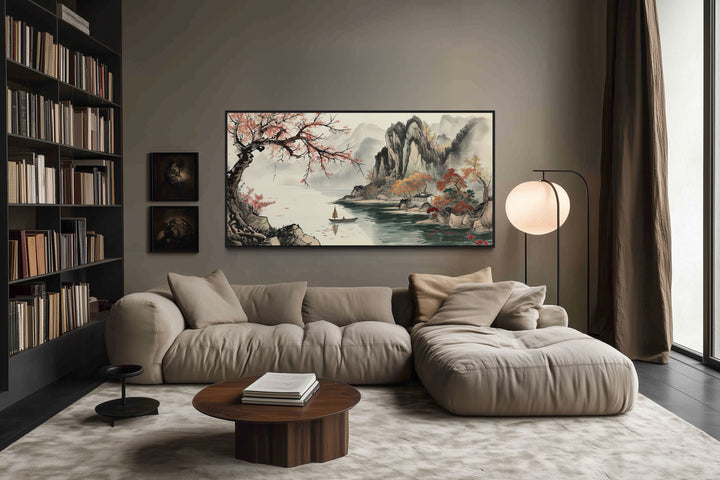 Traditional Chinese Shan Shui Hua landscape canvas wall art above a modern sofa in a living room.