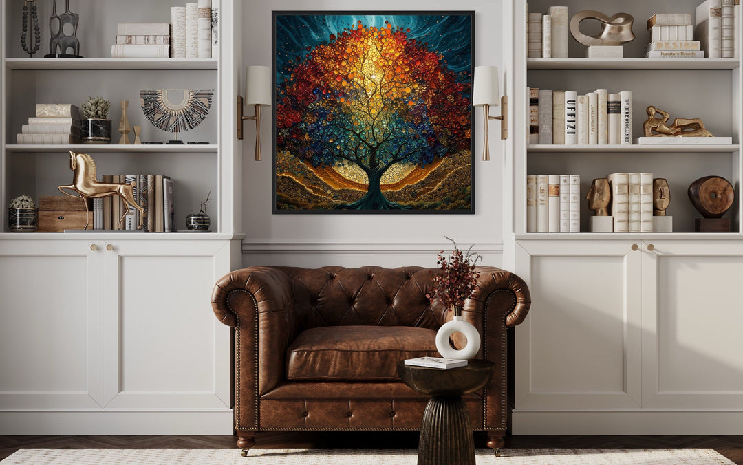 Tree of Life stained glass style Yggdrasil square framed canvas wall art above a leather armchair.