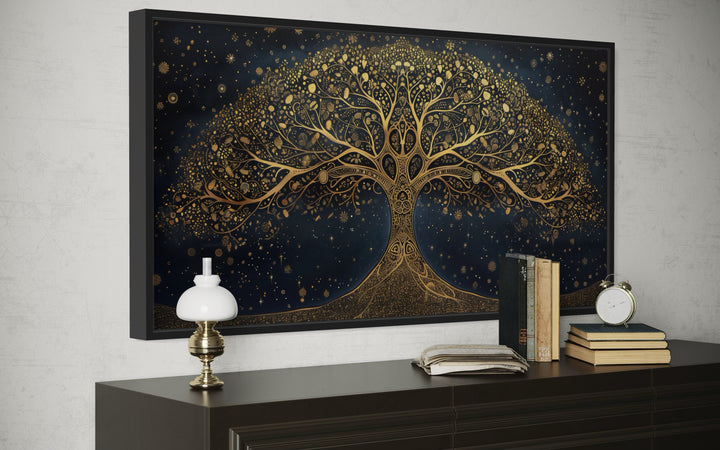 Framed horizontal canvas print of a golden Tree of Life on a navy blue starry background.