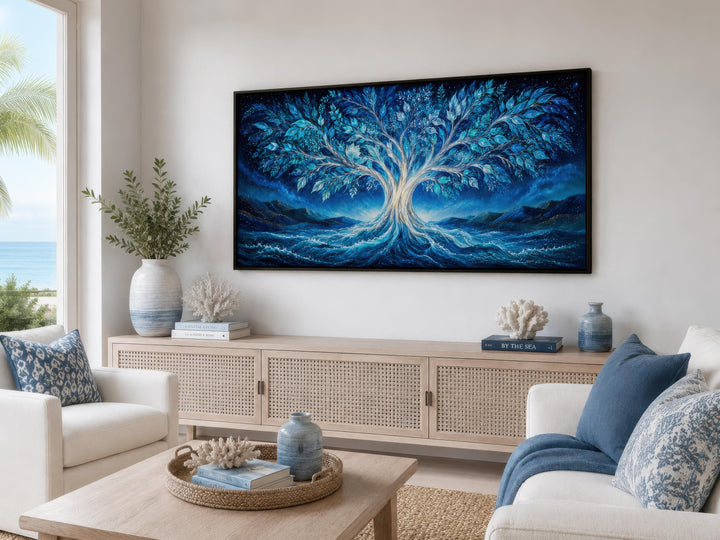 Mystical Tree of Life canvas wall art in glowing blue and teal tones above a modern sideboard.