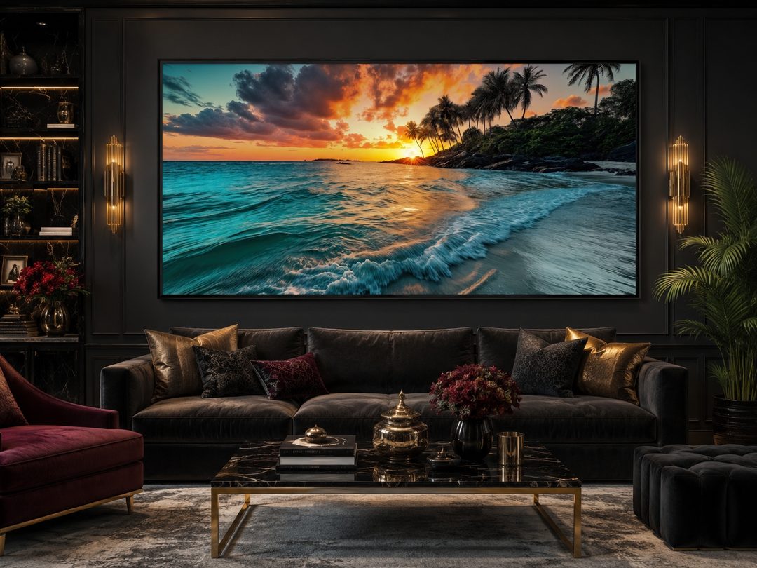 Large framed canvas painting of a tropical beach sunset above a sofa in a dark, modern living room.