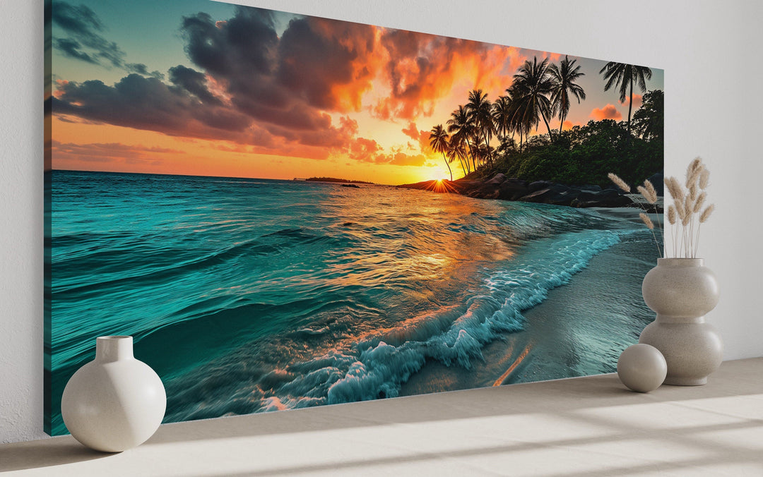 Tropical beach sunset framed canvas wall art featuring palm trees and turquoise ocean waves.