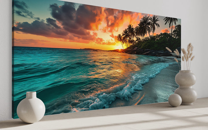 Tropical beach sunset framed canvas wall art featuring palm trees and turquoise ocean waves.