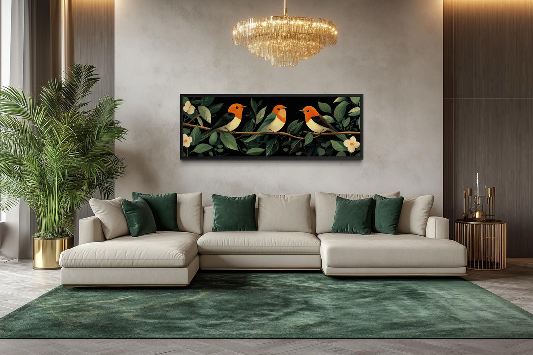 Horizontal wall art featuring three colorful tropical birds on a branch in a modern living room.