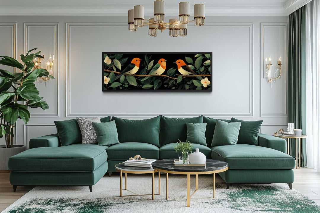 Horizontal canvas print of three colorful tropical birds perched on a branch among green leaves.
