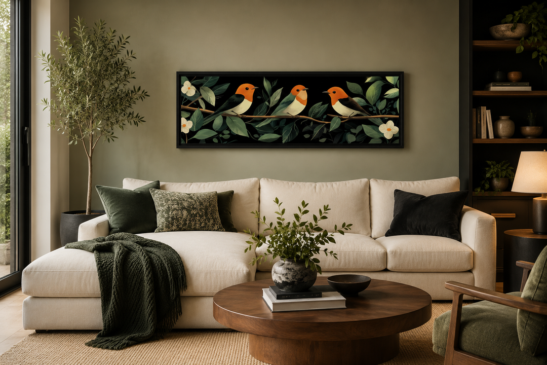 Tropical birds wall art canvas print featuring three orange birds on a branch over a sofa.