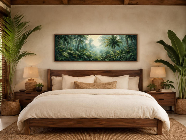 Misty rainforest canvas art with palm trees and lush green foliage above a wooden bed frame.