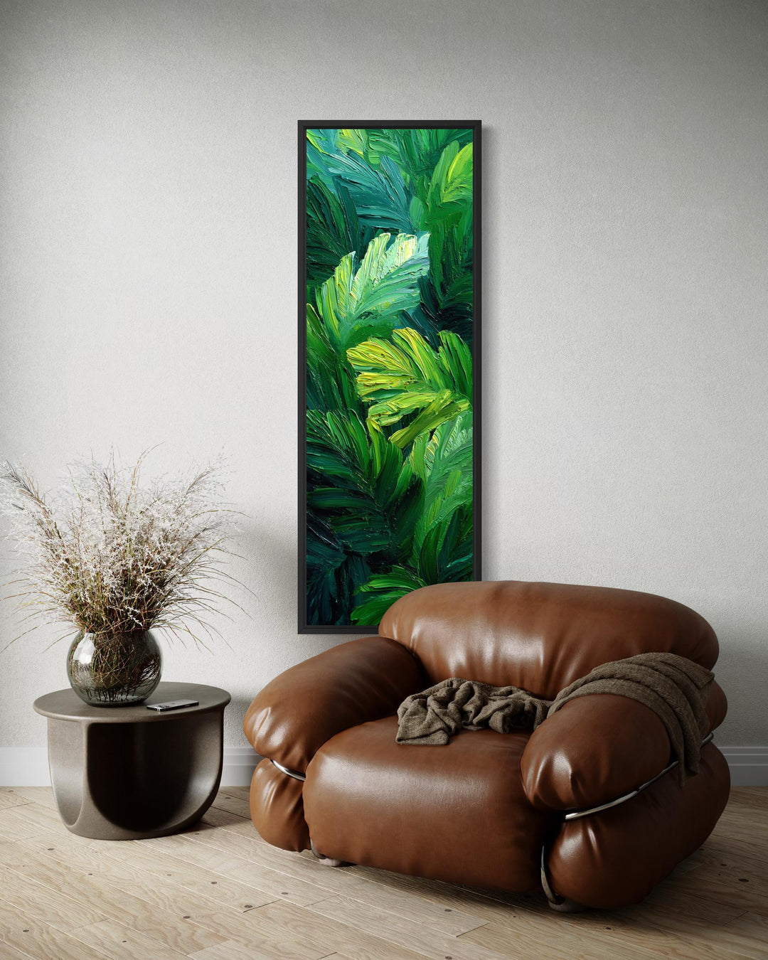 Vertical canvas print of a textured green tropical leaf painting in a modern living room setting.