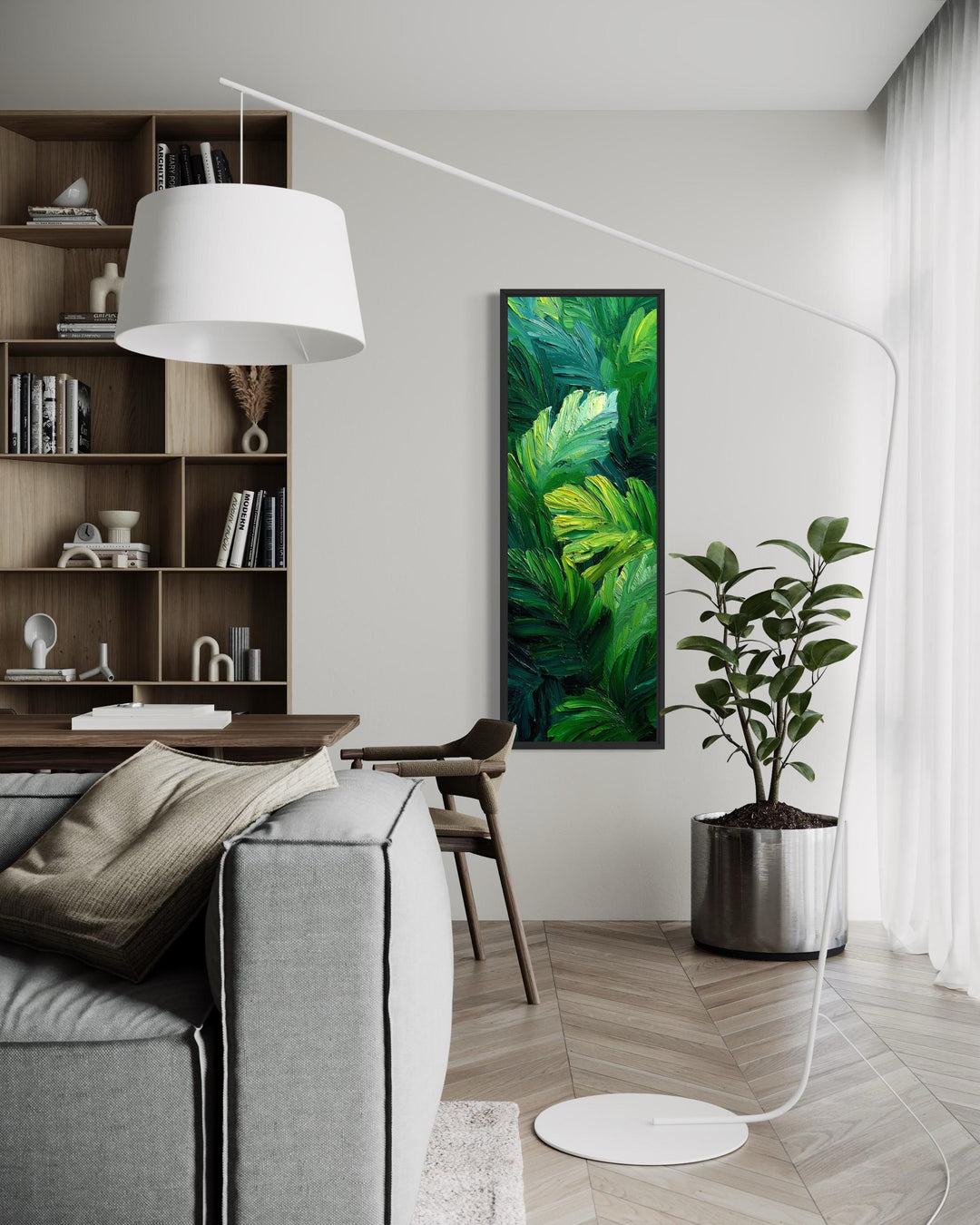 Vertical canvas print of a lush tropical jungle painting with green leaves in a modern living room.