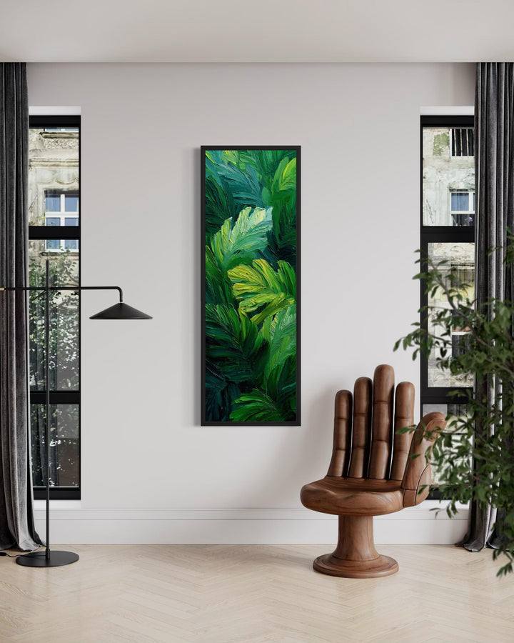 Vertical narrow canvas print of a textured tropical jungle leaf painting in a modern room.