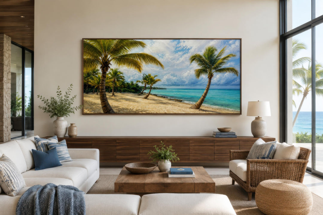 Tropical palm tree beach painting on a horizontal canvas print above a wooden console.