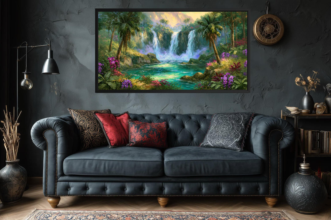 Tropical waterfall jungle paradise canvas wall art displayed above a dark blue tufted sofa.