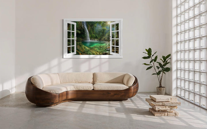 Tropical waterfall lagoon window view canvas wall art displayed in a modern living room.