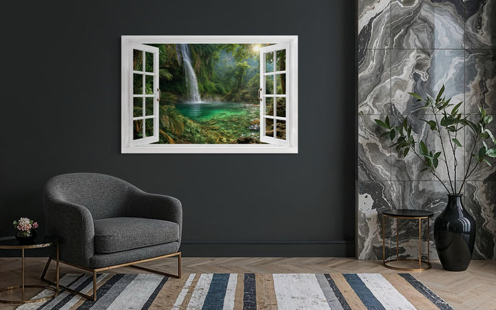 A canvas wall art piece depicting a tropical waterfall through an open white window frame.