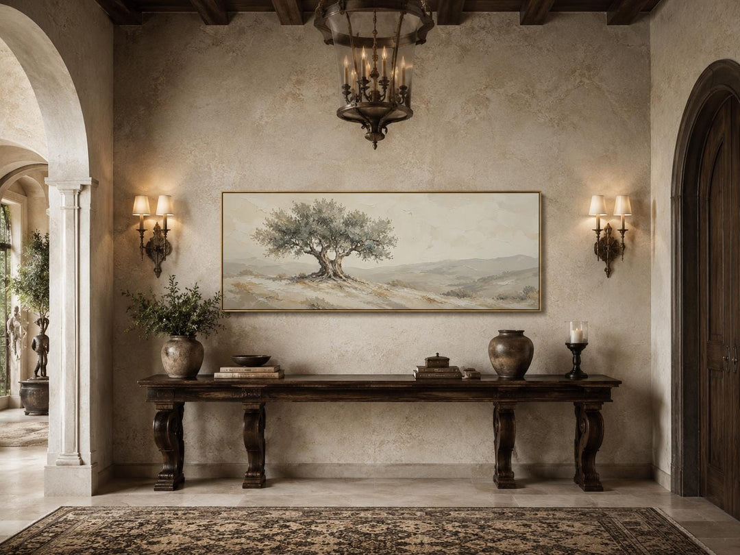 Long horizontal canvas print of a Tuscan olive tree in sage green and neutral tones above a console.