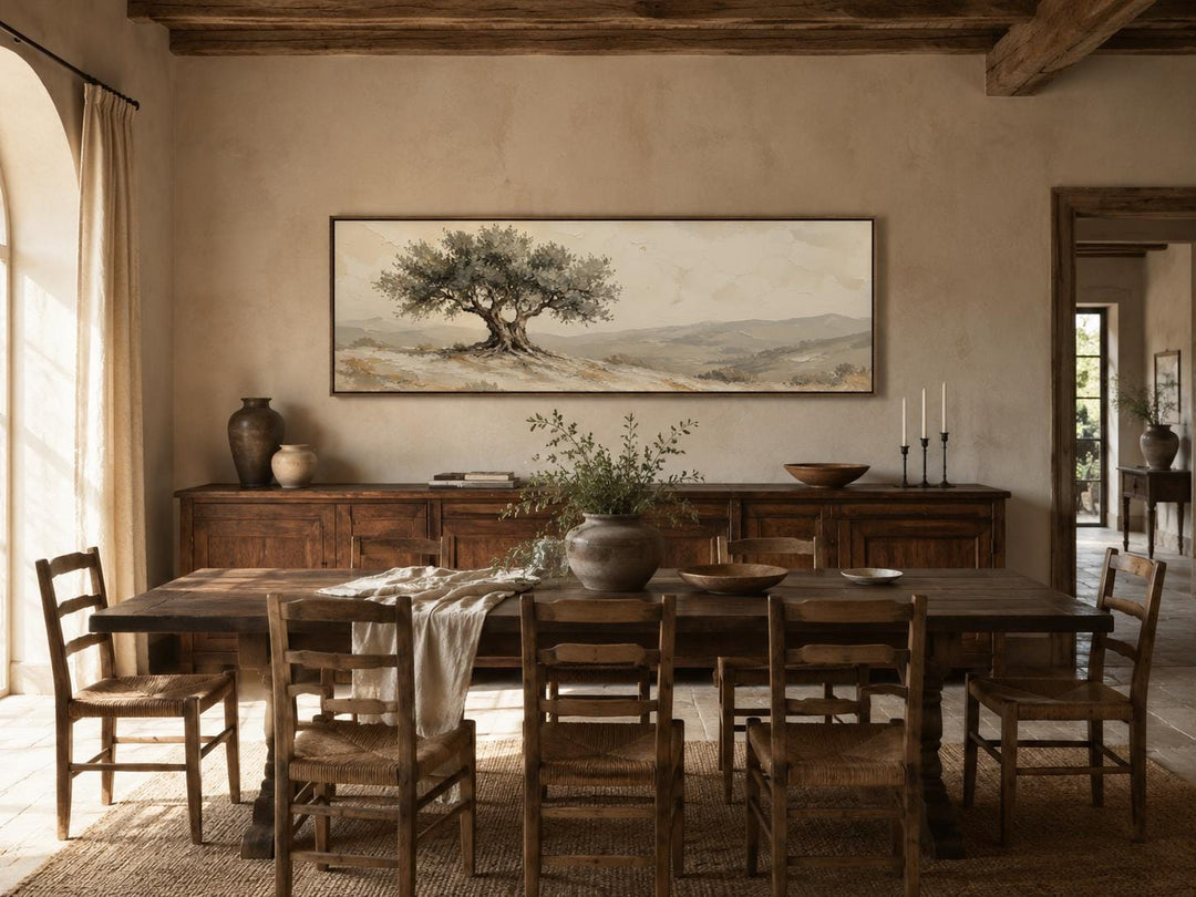 Tuscan Olive Tree canvas print in a long horizontal format above a rustic dining table.