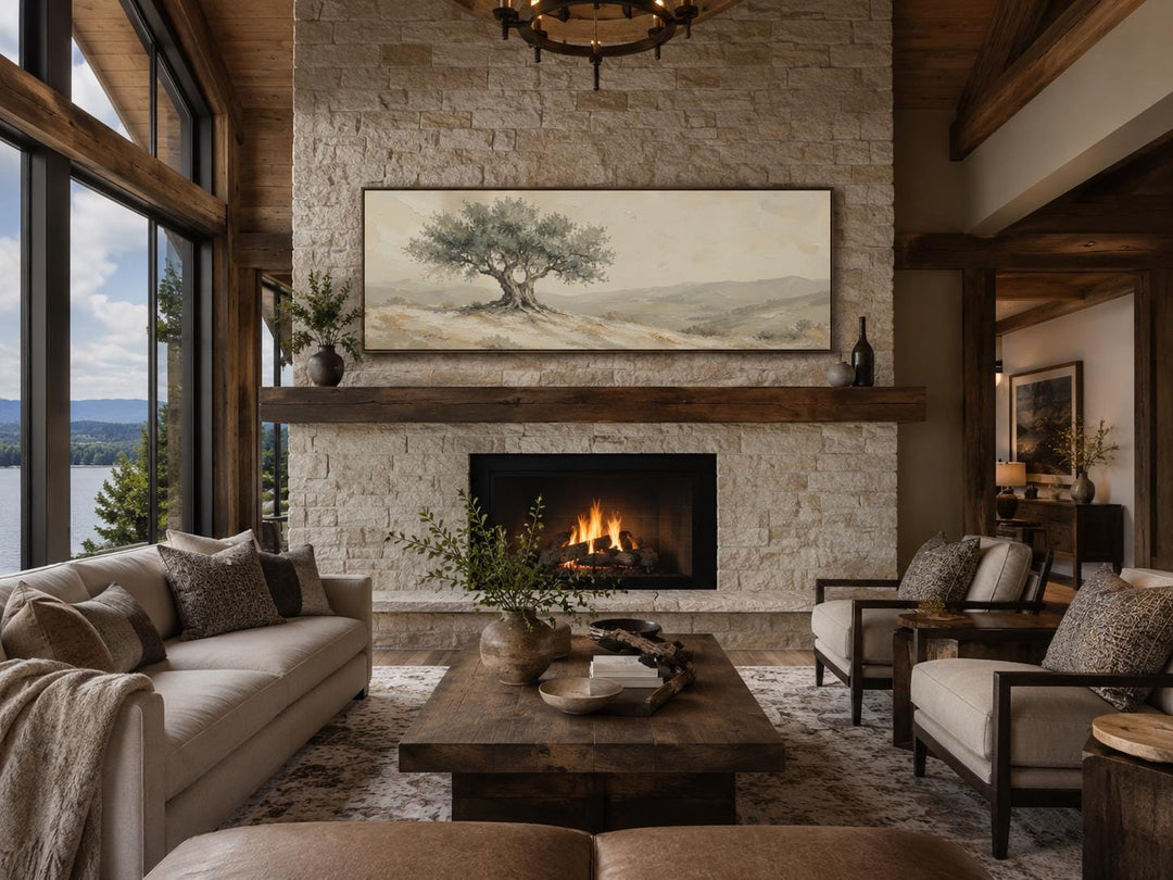 Long horizontal canvas print of a Tuscan olive tree in sage green and taupe above a stone fireplace.