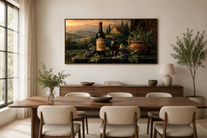 Tuscan wine bottle and landscape painting on canvas displayed in a modern dining room.