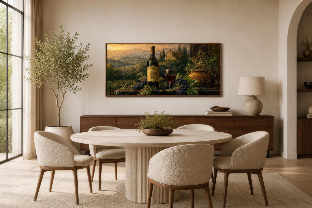 Tuscan wine bottle painting on canvas displayed in a modern dining room with a round stone table.