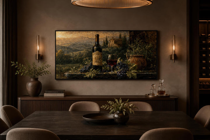 Tuscan wine bottle and vineyard landscape canvas art displayed in a modern, moody dining room.