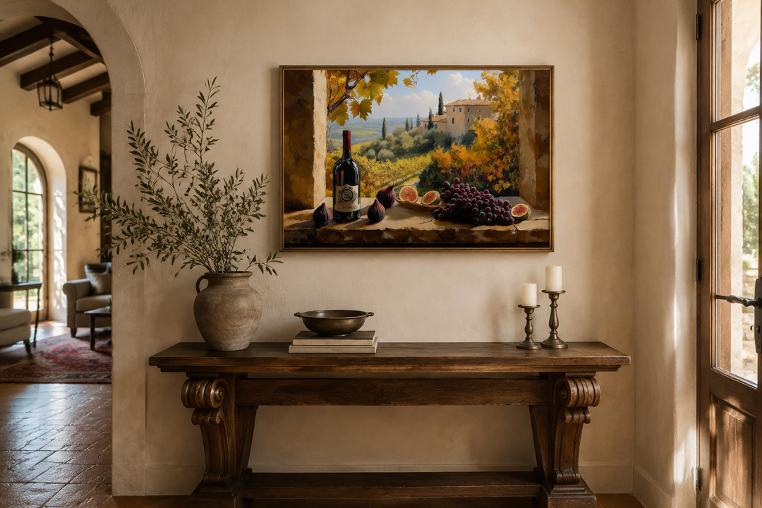 Tuscany vineyard window view wall art with wine bottle and grapes above a rustic wooden console.