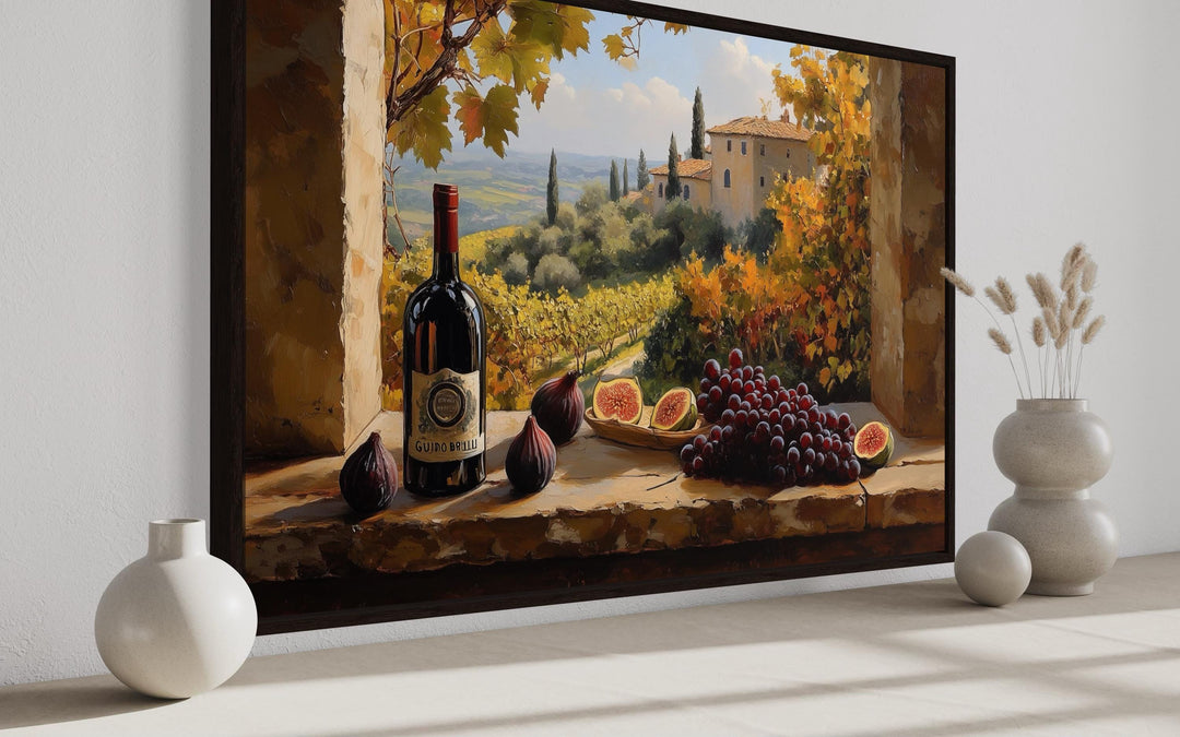Tuscany vineyard window view wall art with wine bottle and grapes in a dining room setting.