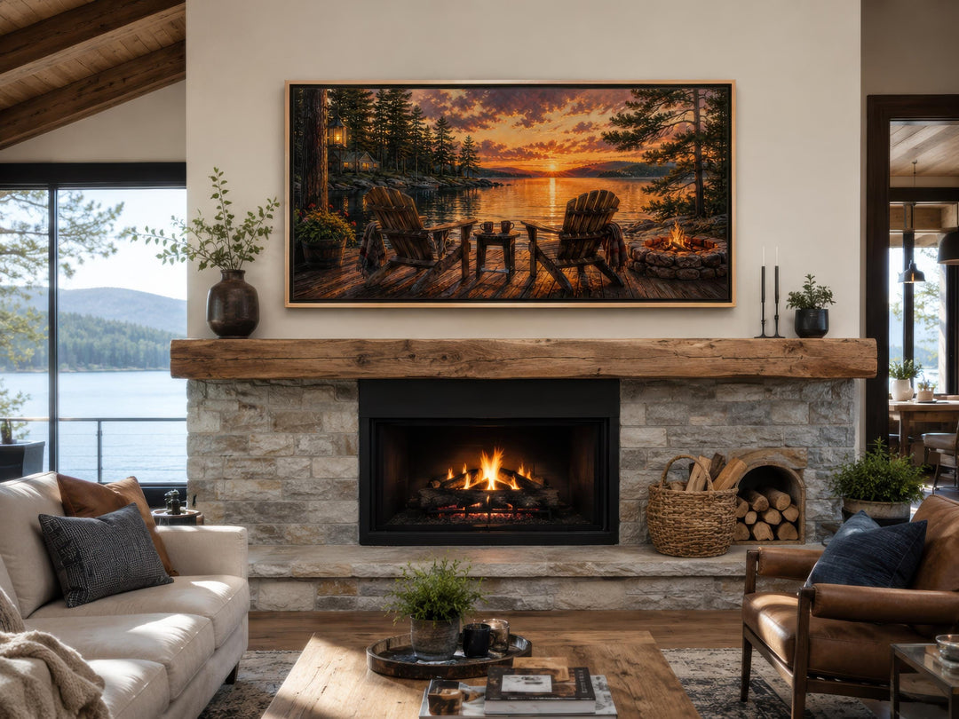 Two Adirondack chairs and a campfire by a lake at sunset framed canvas wall art above a fireplace.