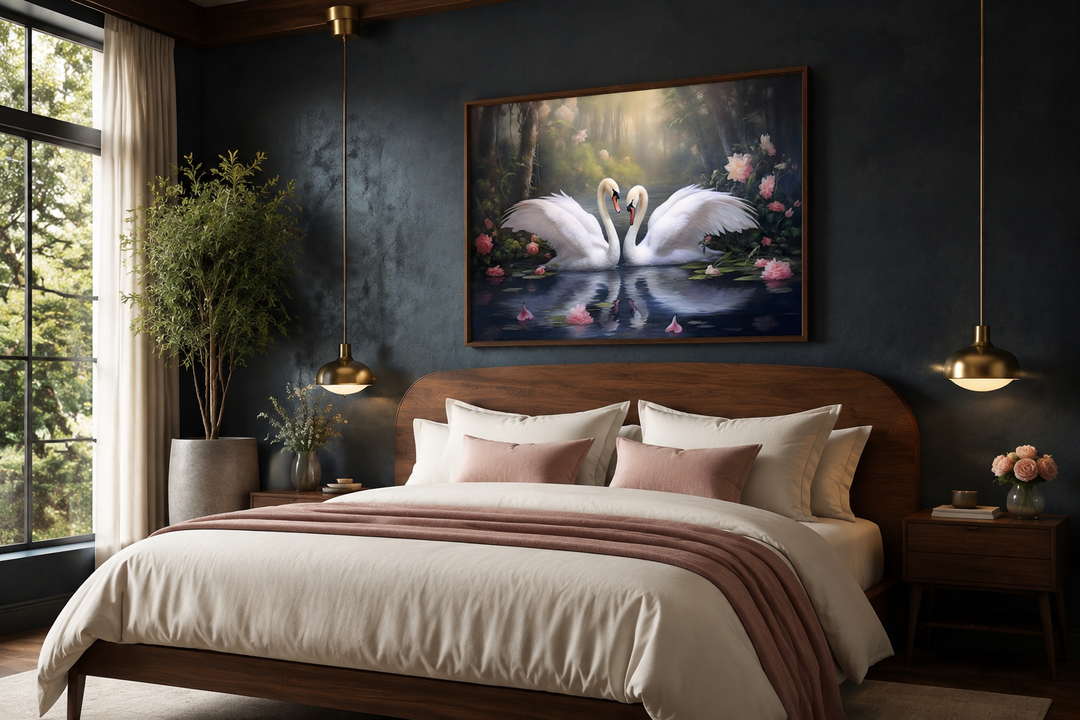 Framed canvas wall art of two white swans on a lake, hanging above a bed in a dark-walled bedroom.